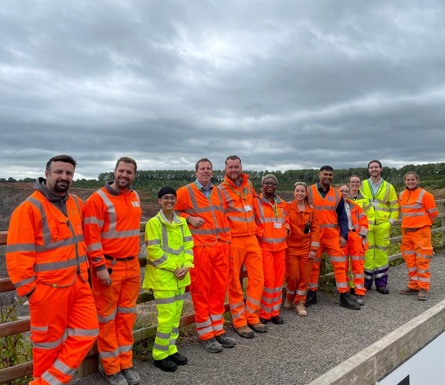 SHE Academy Team - Costain colleagues alongside a fence outside