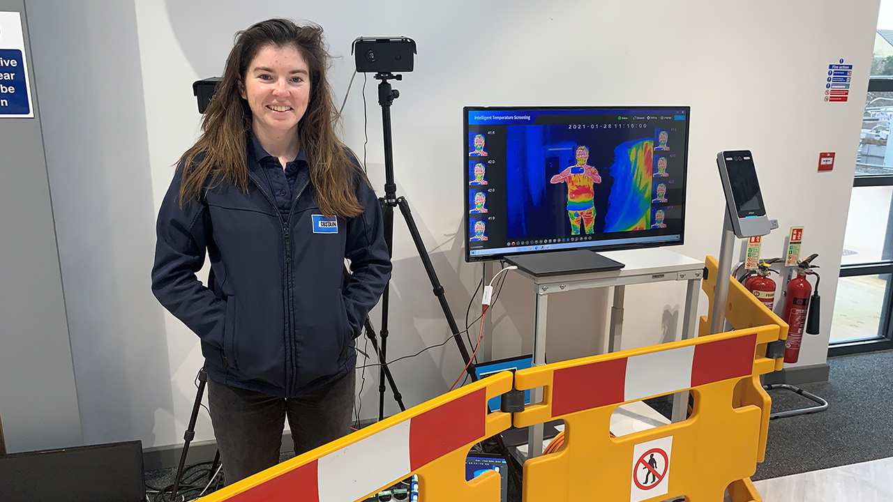 Female apprentice at Costain standing by thermal imaging technology