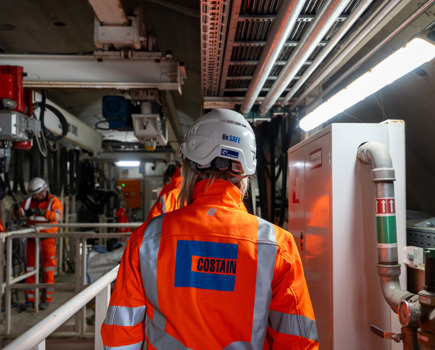 Woman in Costain PPE on construction site