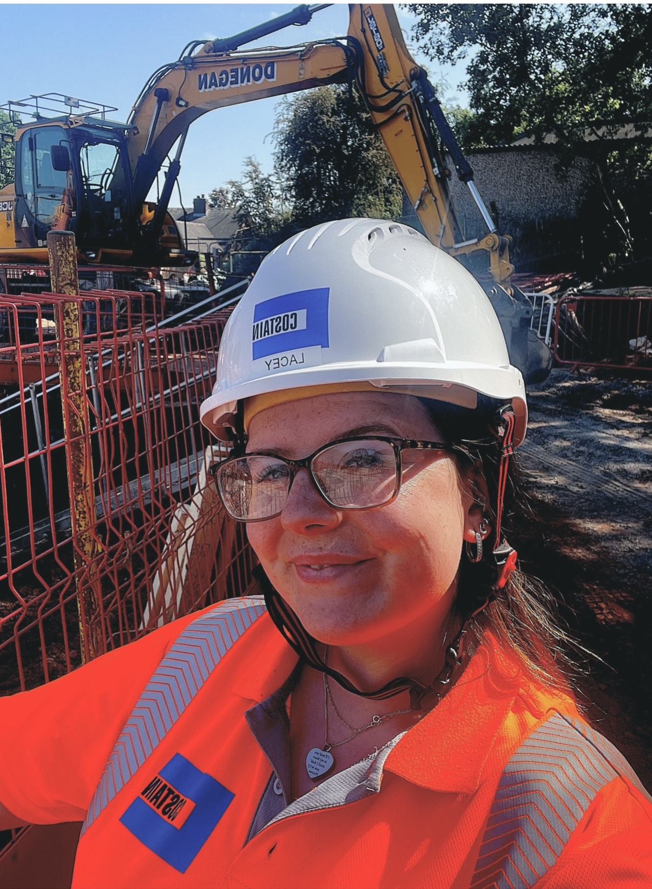 Lacey Hollingsworth, apprentice civil engineer in hard hat and PPE