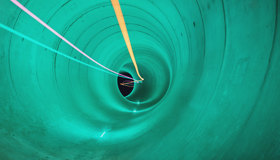 Tideway tunnel in green with neon lights