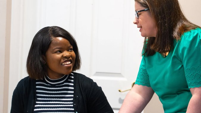 Two women in a classroom environment
