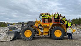 JCB digger with SHE Academy Costain colleagues