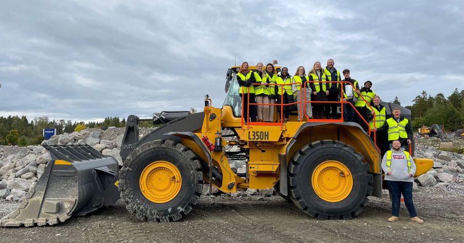 JCB digger with SHE Academy Costain colleagues